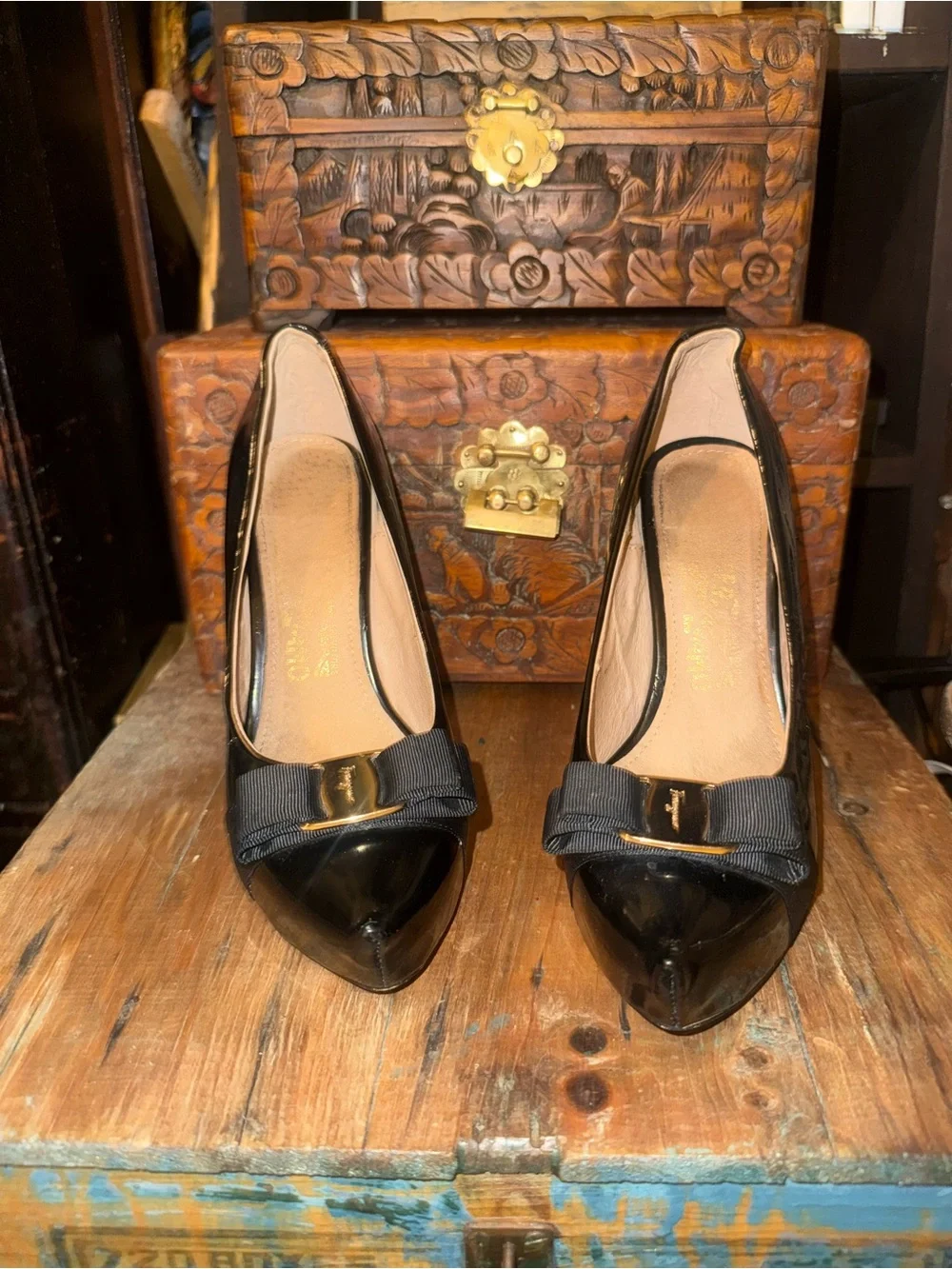 Salvatore Ferragamo Black Patent featuring iconic gold plate & grosgrain bow